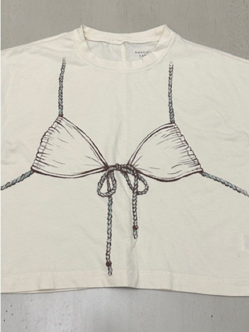 AE Women’s Cream Boxy Bikini Graphic Crop T-Shirt